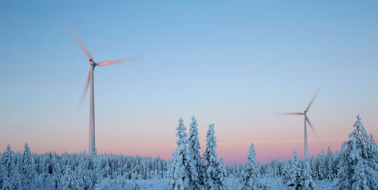 Wind mills in forest in winter
