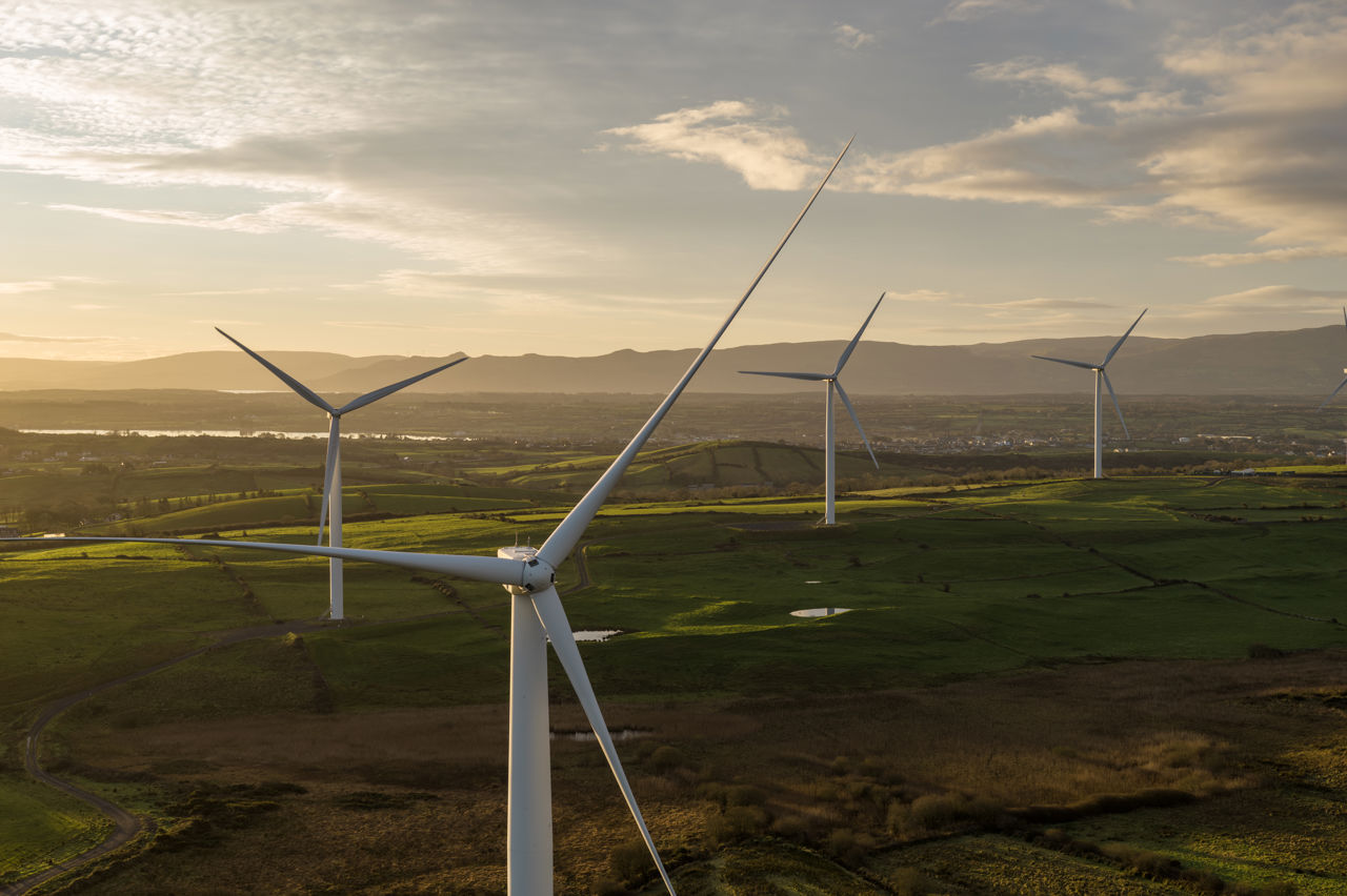 Man on the top of a wind turbine