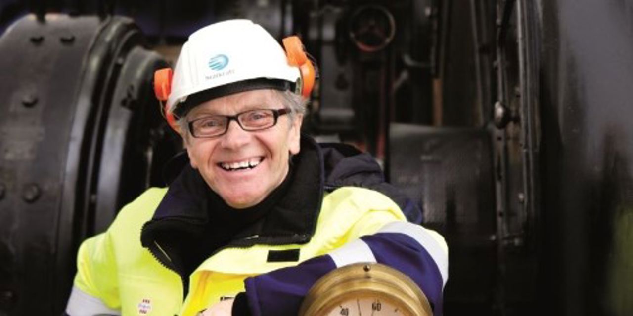 Smiling employee inside power plant