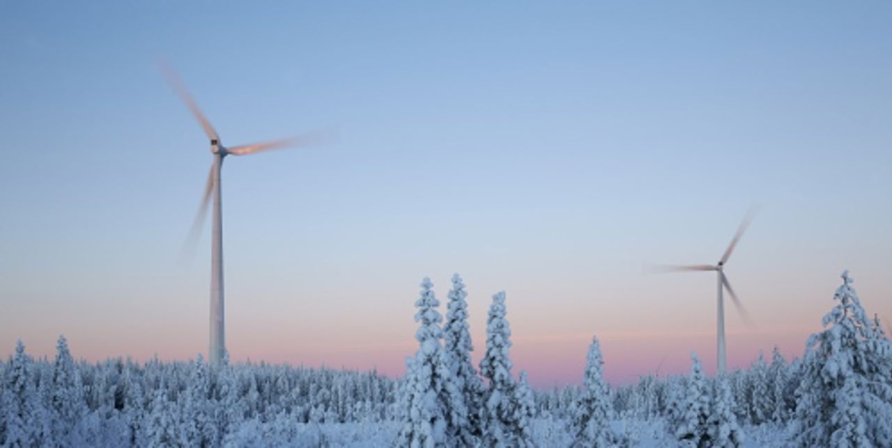 Wind mills in forest in winter